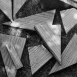 black and white picture of broken up deck boards.