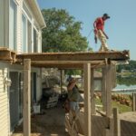 Construction worker standing on a deck during construction