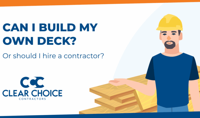 can I build my own deck, or should I hire a contractor? man wearing hardhat in front of stack of lumber.