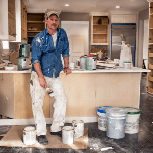 man with paint on his clothes