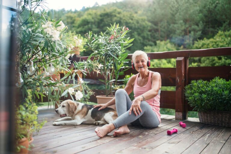 woman sitting on floor of deck