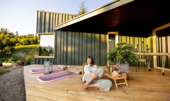 view of a woman lounging on a new deck