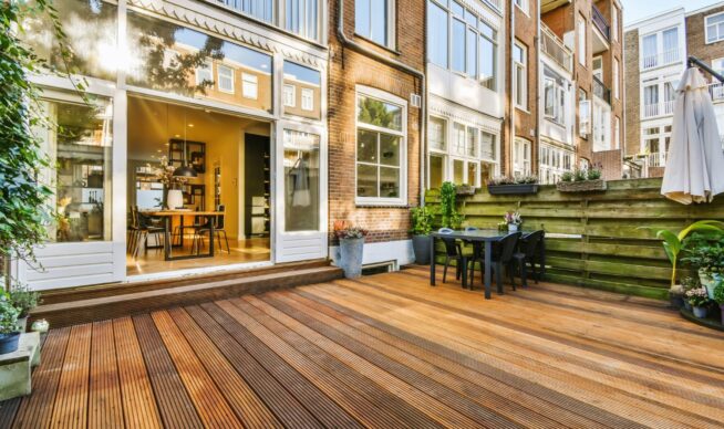 view of a custom deck connected to a house.