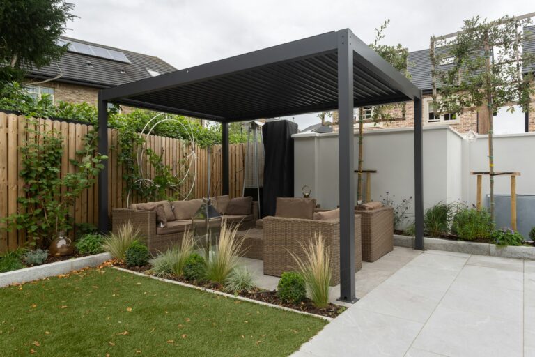 dark gray pergola in an outdoor living space.