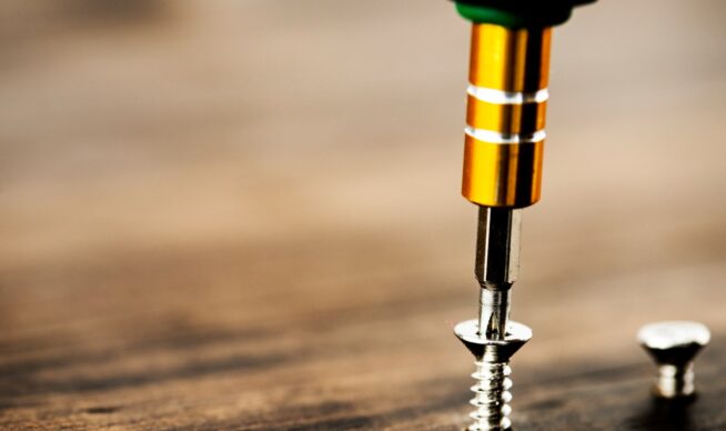 Screw getting put into a deck.