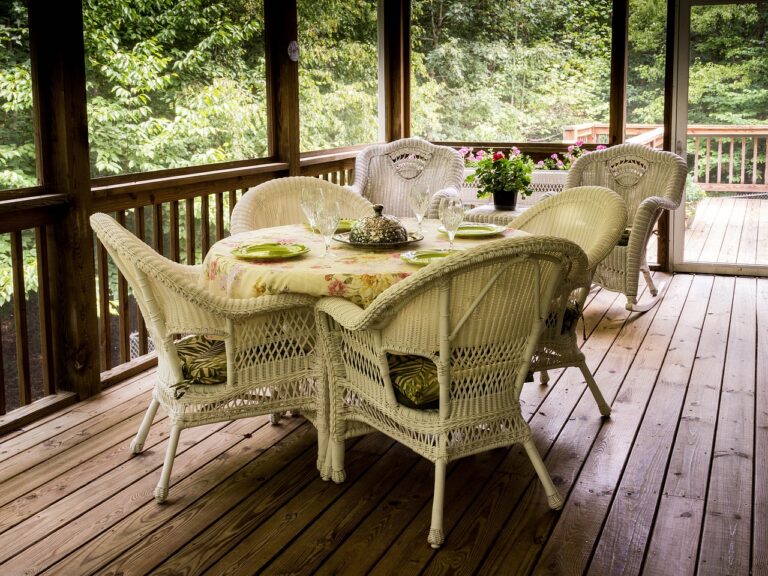 Sreened in outdoor custom deck with table and chairs