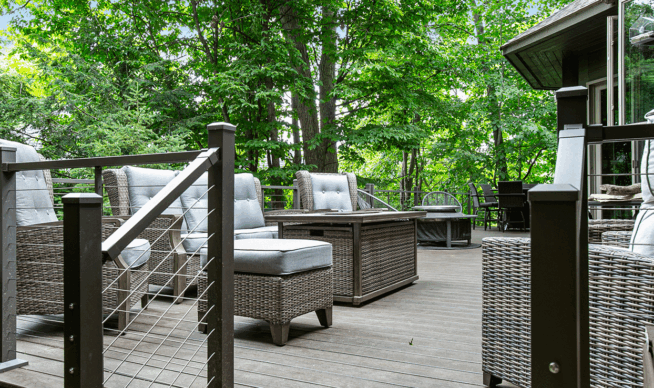 Custom deck with railing and stairs built in a forest