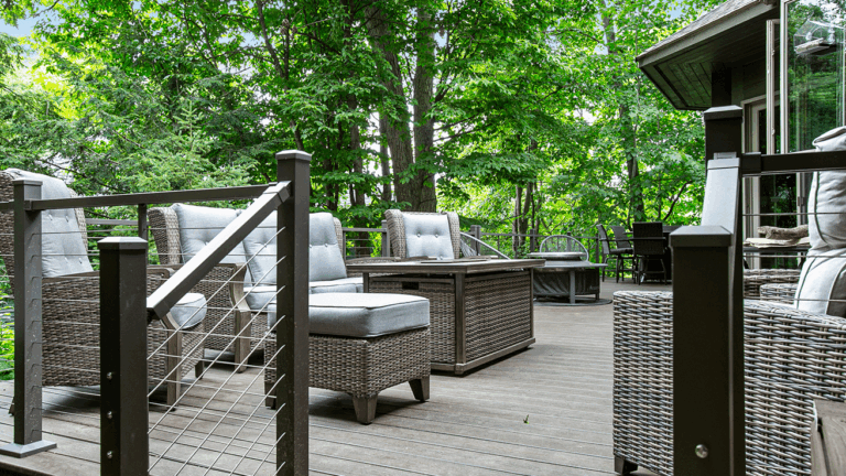 Custom deck with railing and stairs built in a forest