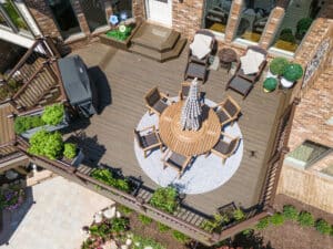Closeup aerial view of custom composite deck with metal railing in South Lyon, Michigan