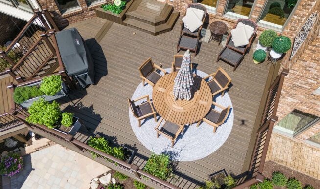 Closeup aerial view of custom composite deck with metal railing in South Lyon, Michigan