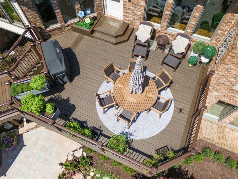 Closeup aerial view of custom composite deck with metal railing in South Lyon, Michigan