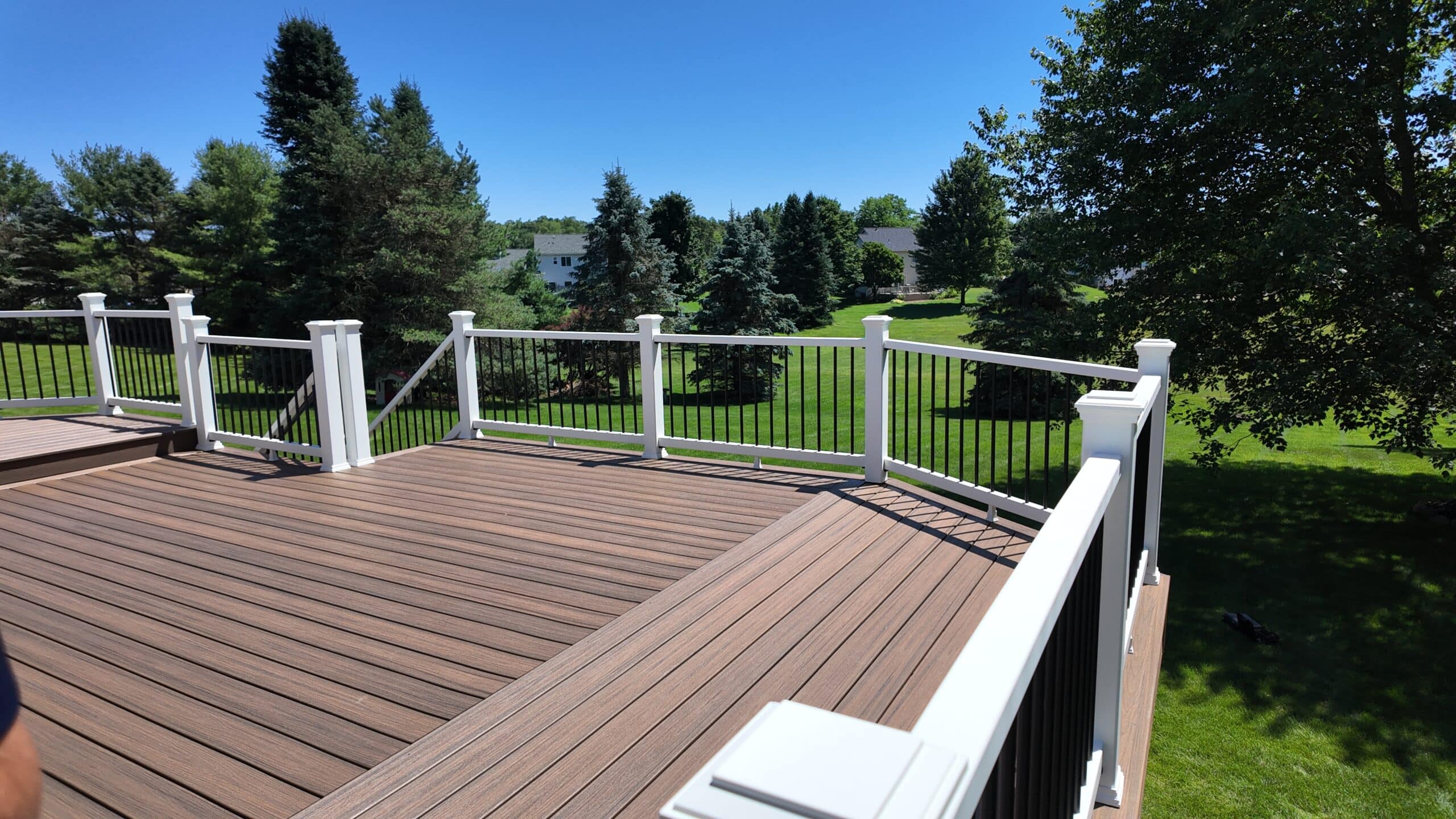 Custom composite deck with stairs and metal railing