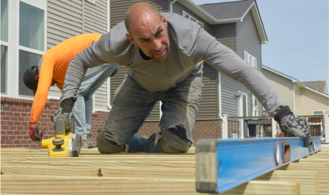 Deck installer hard at work