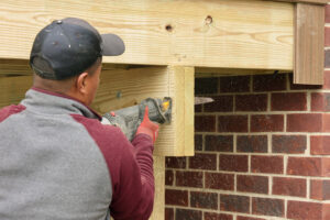 Deck crew working hard removing excess framing