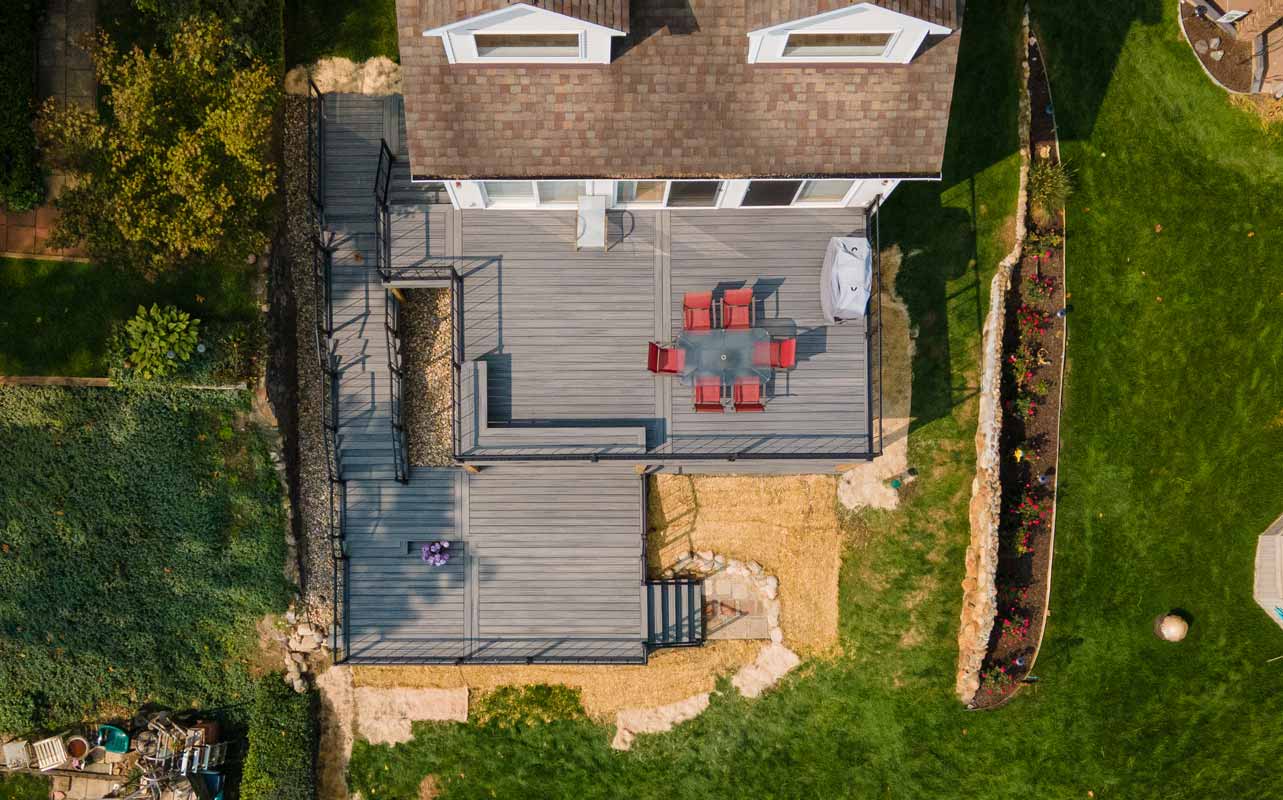 birds eye view of a backyard and deck. 