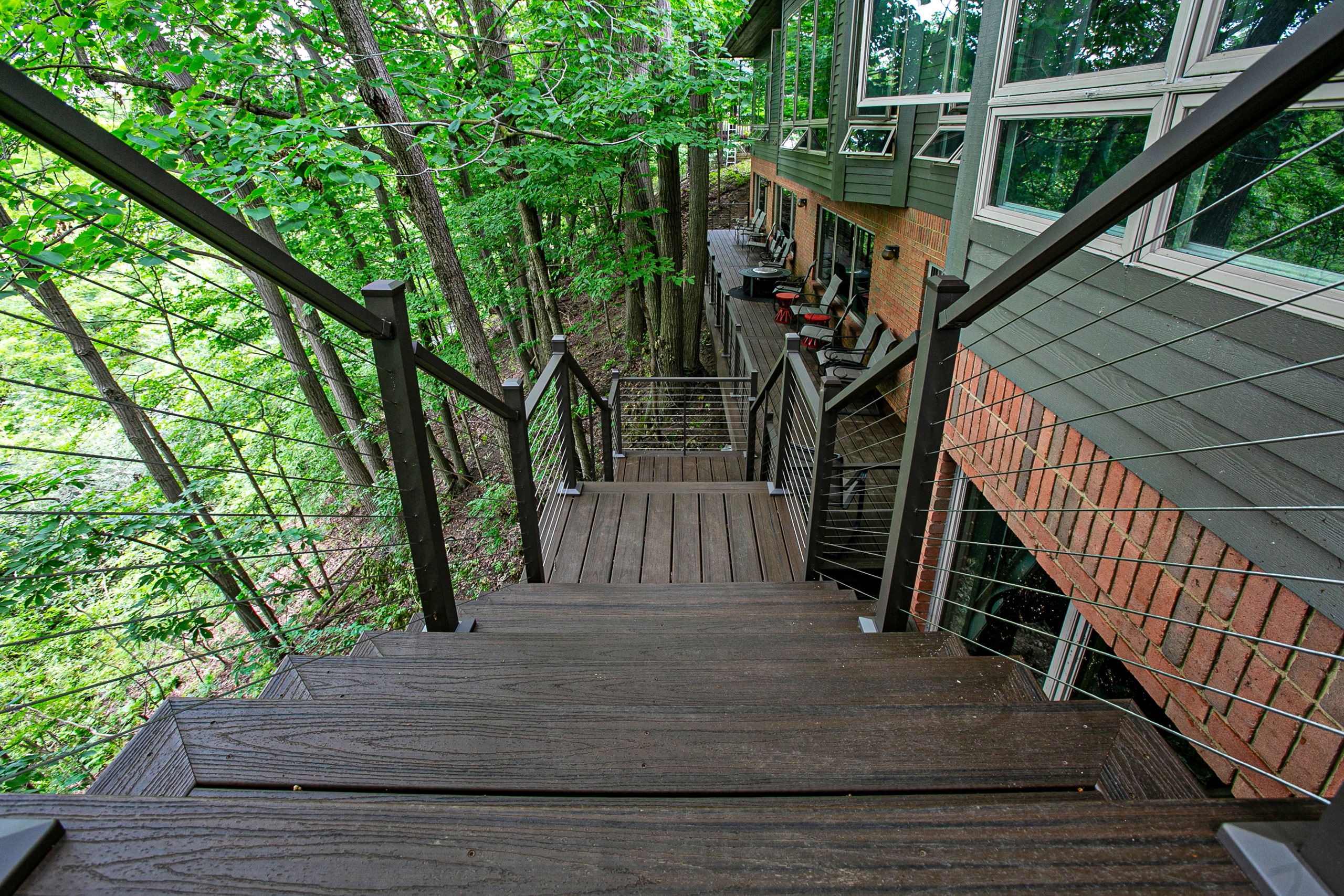 Stairs leading to the lower level wrap around deck in Livingston Co, MI