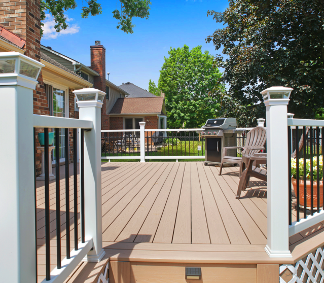 Low attached deck with metal railing and composite surface